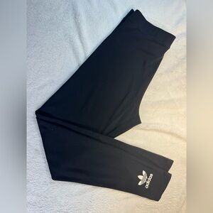 Women’s black Adidas leggings.